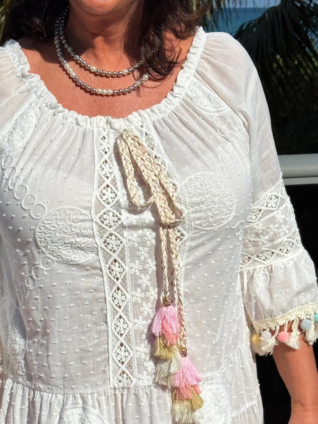 Style 1110 white summer dress with rainbow pom pom